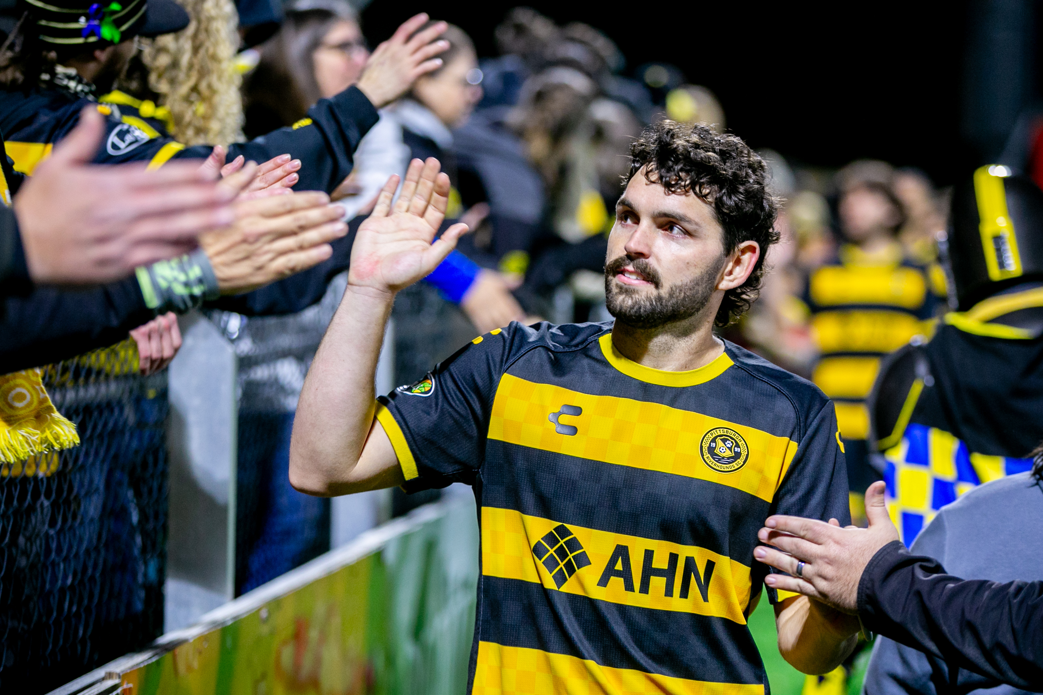 Pittsburgh Riverhounds midfielder Jackson Walti gives high fives to fans after the team's match against Phoenix Rising FC on Oct. 25, 2025 at Highmark Stadium in Pittsburgh. (Photo: Chris Cowger/Riverhounds SC)
