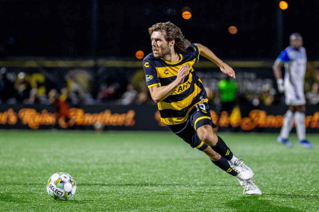 Pittsburgh Riverhounds midfielder Bradley Sample turns up the field in the team's playoff triumph over Hartford Athletic on Nov. 1, 2025 at Highmark Stadium in Pittsburgh. (Photo: Chris Cowger/Riverhounds SC)