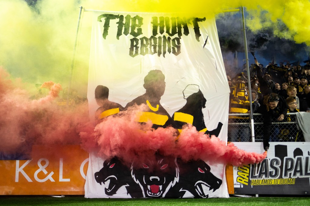 Smoke billows across the front of a fan-created tifo before the Pittsburgh Riverhounds' playoff match against Hartford Athletic on Nov. 1, 2025 at Highmark Stadium in Pittsburgh. (Photo: John Sykes/Riverhounds SC)
