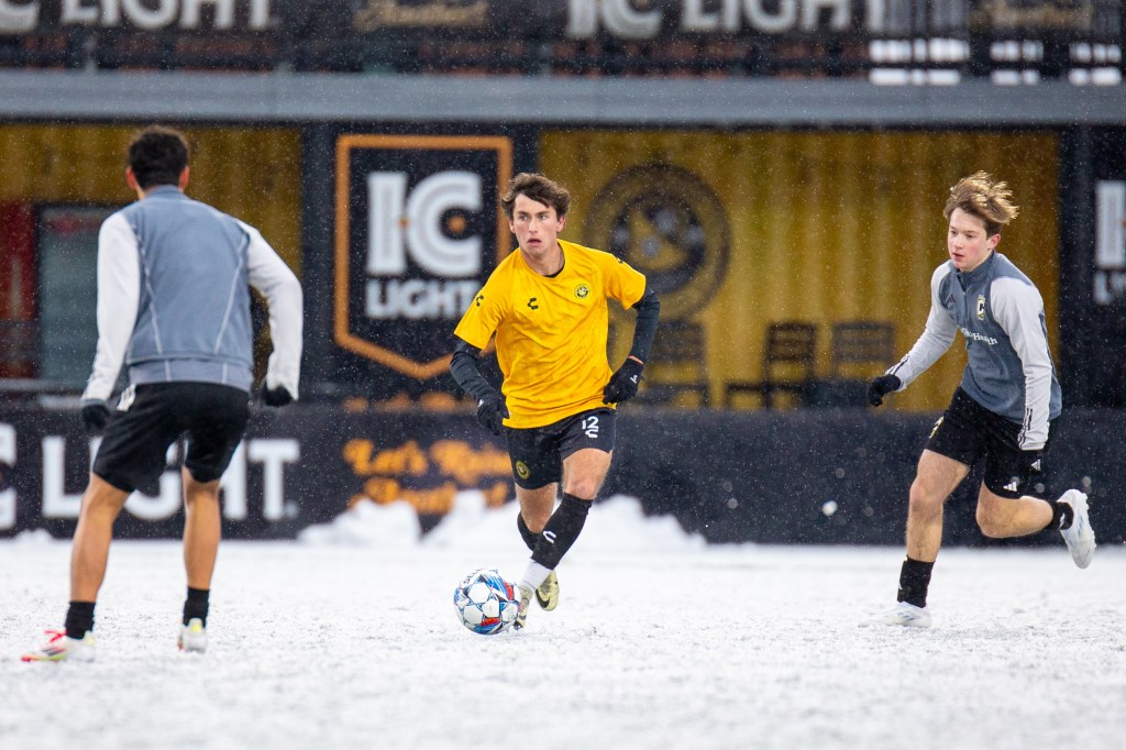 Charles Ahl dribbles between a pair of Columbus Crew 2 defenders in the Pittsburgh Riverhounds' preseason match on Feb. 16, 2025 at Highmark Stadium in Pittsburgh. (Photo: Chris Cowger/Riverhounds SC)