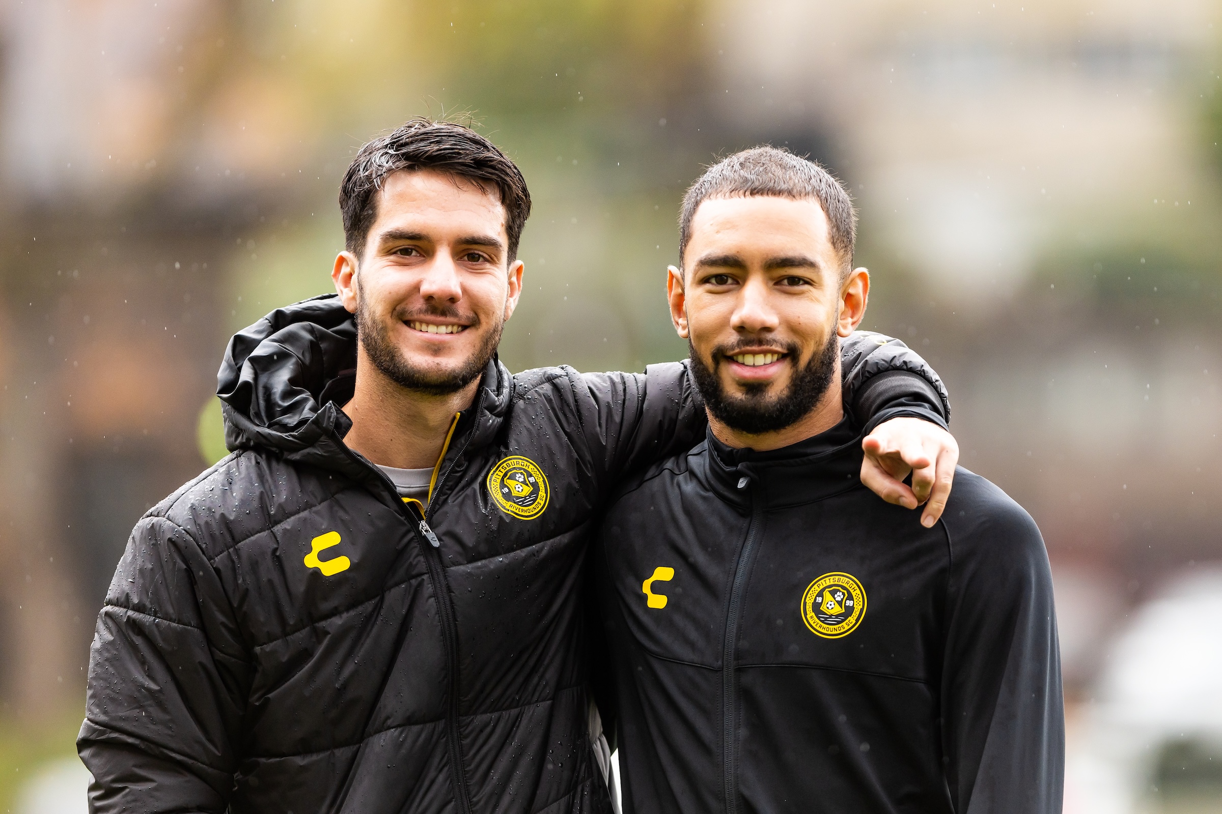 Pittsburgh Riverhounds defenders Beto Ydrach (left) and Guillaume Vacter smile for a photo at training on Oct. 21, 2025 at the AHN Montour Sports Complex in Coraopolis, Pa. (Photo: Mallory Neil/Riverhounds SC)