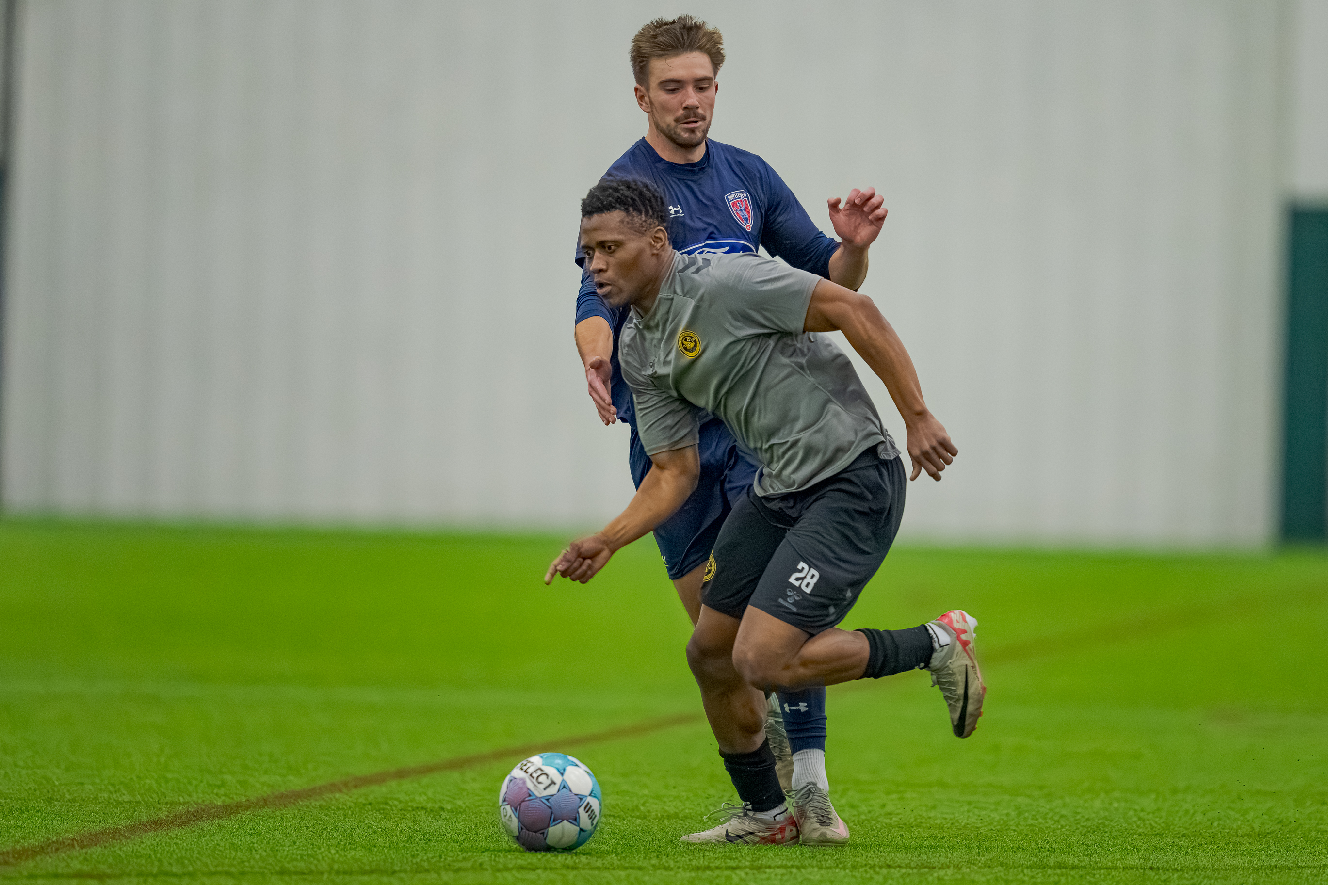 Illal Osumanu dribbles away from Indy Eleven's Dylan Sing in the Pittsburgh Riverhounds' 3-0 preseason win on Feb. 6, 2026 at Grand Park in Westfield, Ind. (Photo: Matt Schlotzhauer/Indy Eleven)