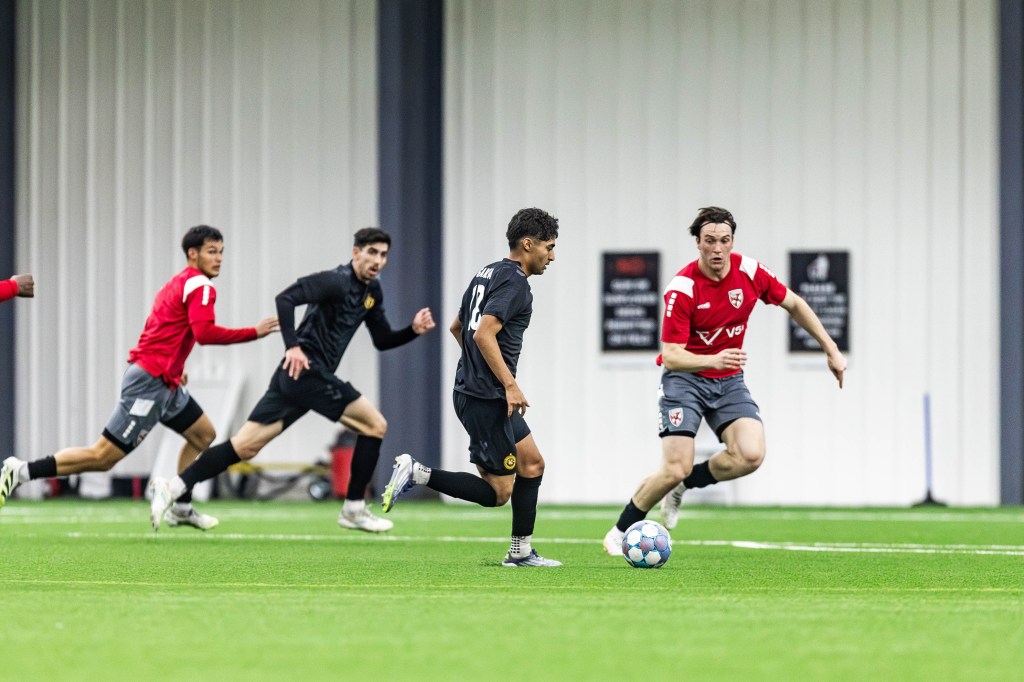 Pittsburgh Riverhounds midfielder Jorge Garcia dribbles toward goal while Trevor Amann makes a run off the ball in the Hounds' 2-1 preseason win over Loudoun United FC on Feb. 13, 2026 at the AHN Montour Sports Complex in Coraopolis, Pa. (Photo: Mallory Neil/Riverhounds SC)