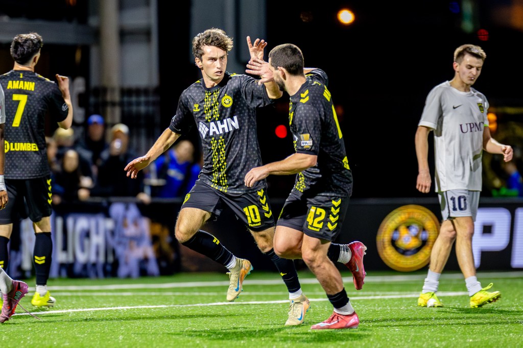 Charles Ahl celebrates his goal with Jackson Walti in the Pittsburgh Riverhounds' 2-1 win over Steel City FC in the U.S. Open Cup on March 25, 2026 at Highmark Stadium in Pittsburgh. (Photo: Chris Cowger/Riverhounds SC)