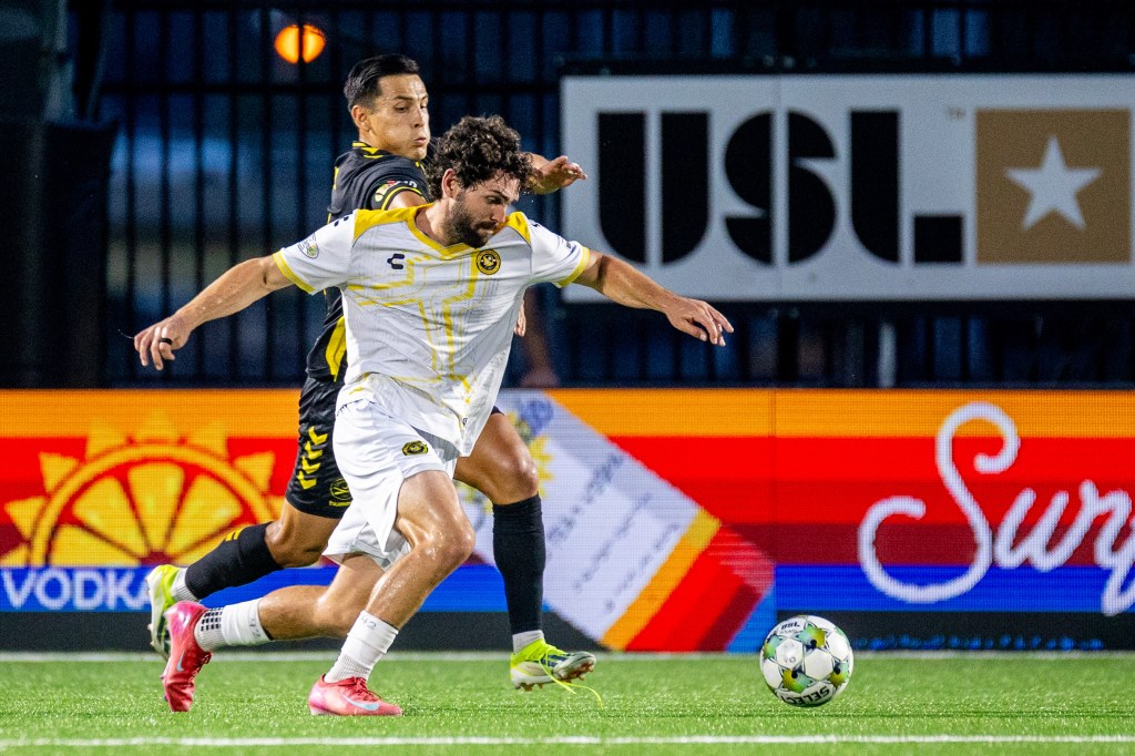 Pittsburgh Riverhounds midfielder Jackson Walti holds off a challenge from the Charleston Battery's Rubio Rubin in the teams' meeting on Aug. 16, 2025 at Highmark Stadium in Pittsburgh. (Photo: Chris Cowger/Riverhounds SC)