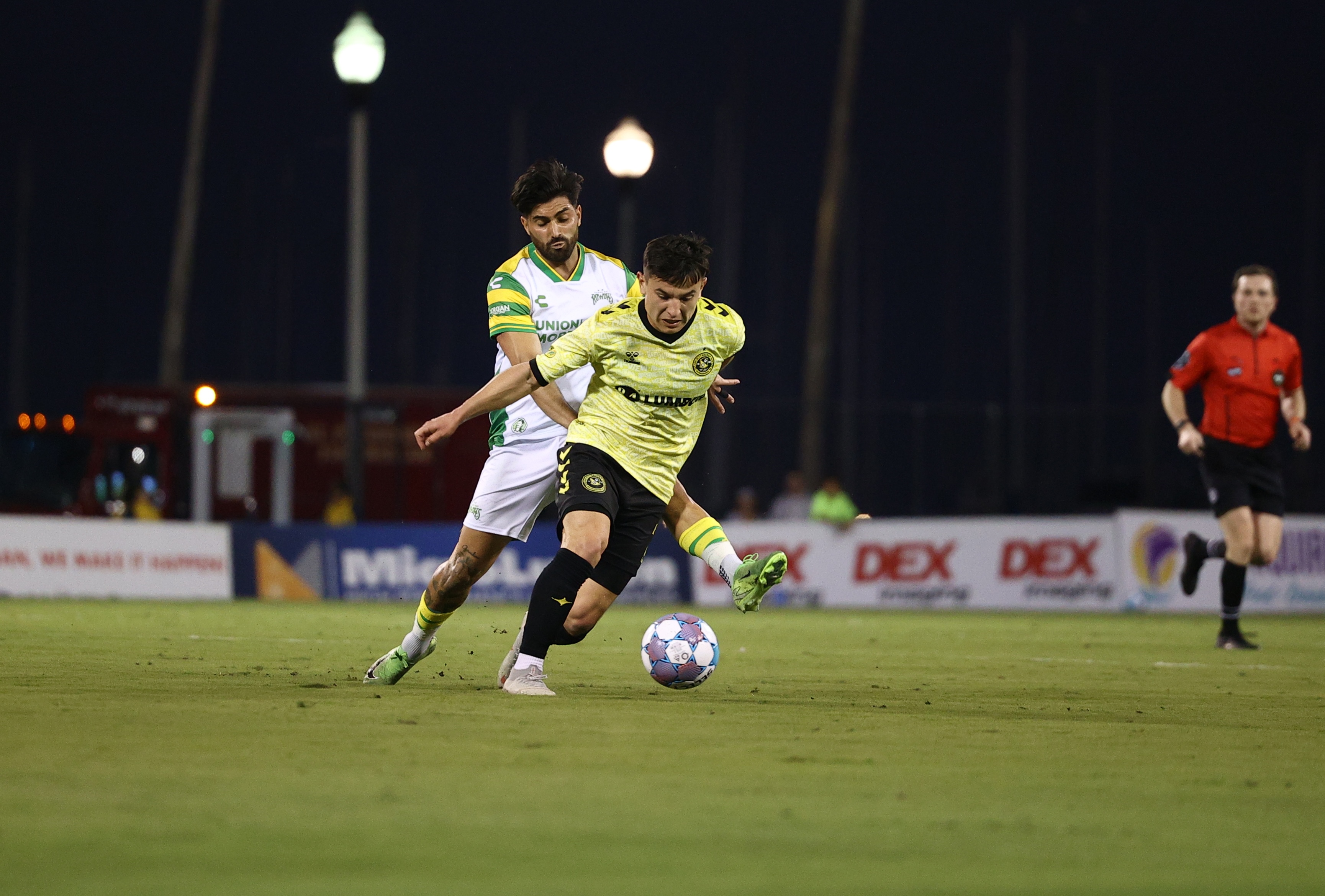 The Pittsburgh Riverhounds' Danny Griffin is pressured on the ball by the Tampa Bay Rowdies' Marco Micaletto in the team's match March 21, 2026 at Al Lang Stadium in St. Petersburg, Fla. (Photo: Tampa Bay Rowdies)