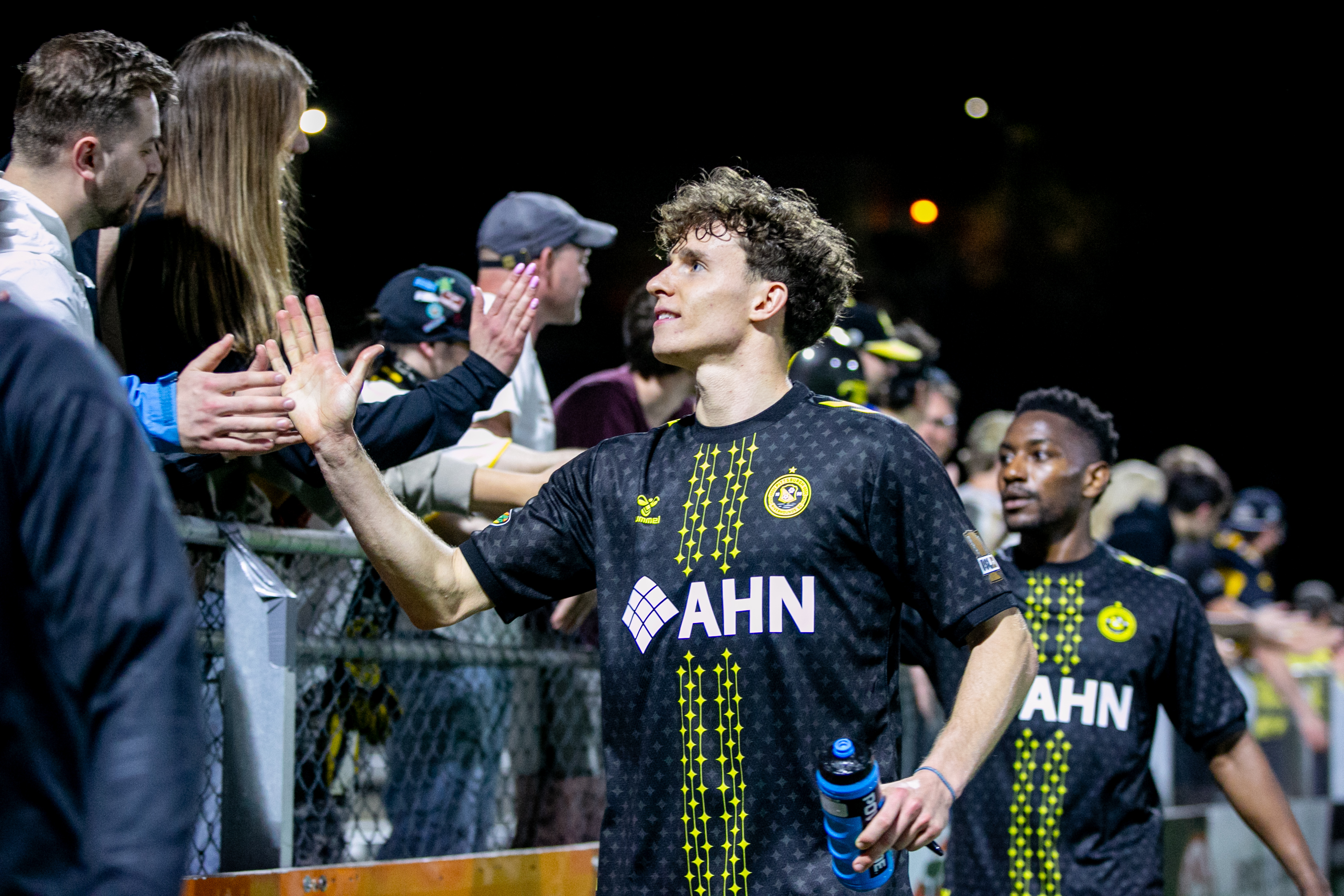 Lasse Kelp and Perrin Barnes celebrate with fans after the Pittsburgh Riverhounds' 2-0 win over Virginia Dream FC in the U.S. Open Cup on March 25, 2026 at Highmark Stadium in Pittsburgh. (Photo: Chris Cowger/Riverhounds SC)