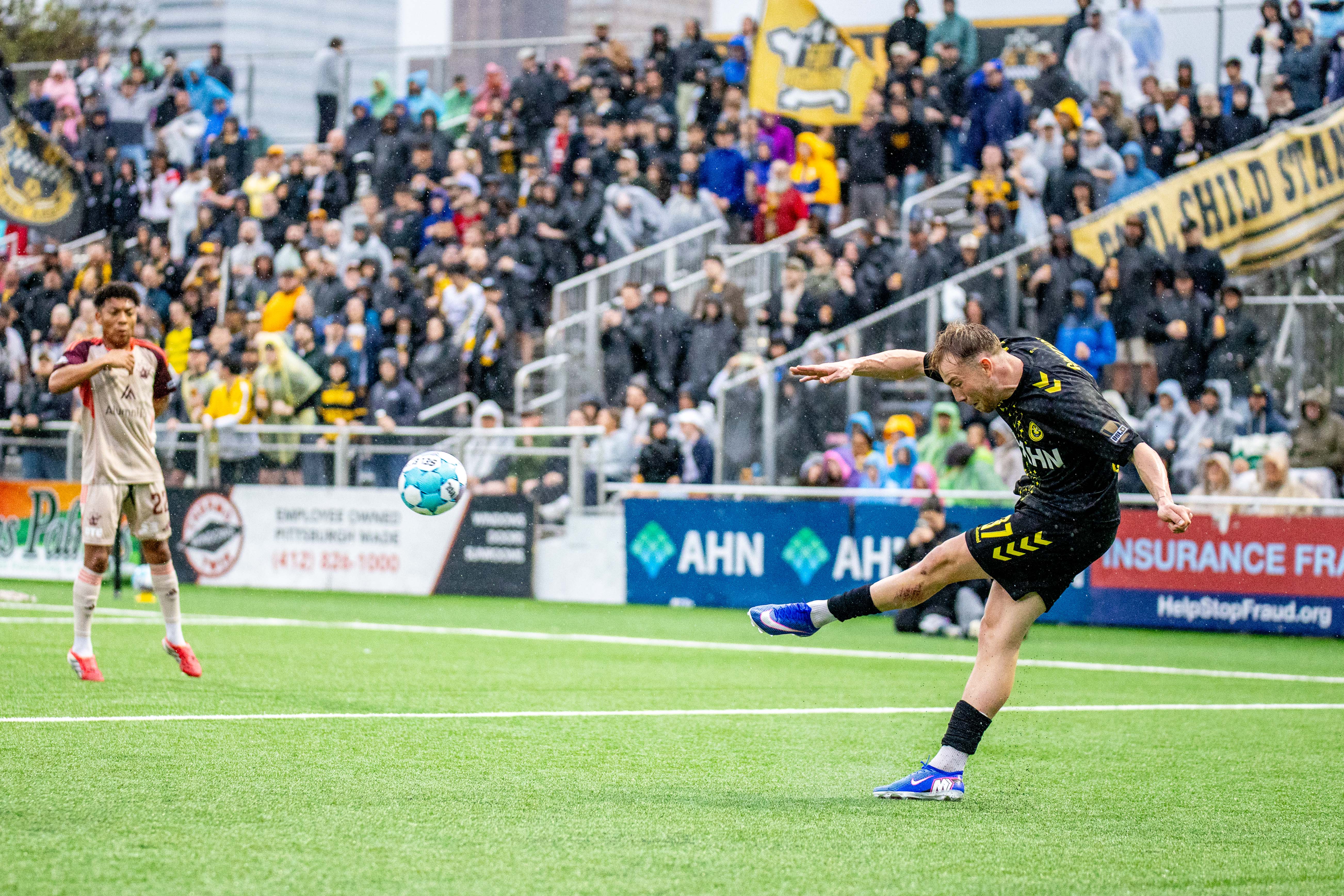 Pittsburgh Riverhounds midfielder Eliot Goldthorp delivers a free kick in the team's 2-1 win over Detroit City FC on April 18, 2026 at Highmark Stadium in Pittsburgh. (Photo: Chris Cowger/Riverhounds SC)