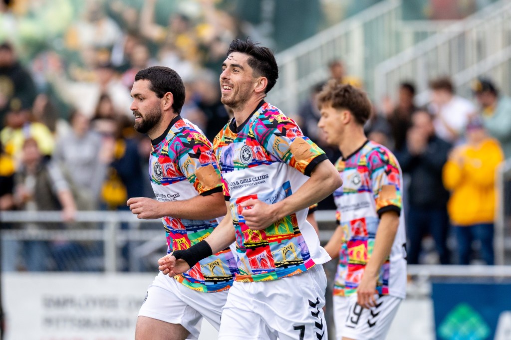 Pittsburgh Riverhounds double goal scorer Trevor Amann (center) smiles after his first tally in the team's 3-0 win over Greenville Triumph SC on April 25, 2026 at F.N.B. Stadium in Pittsburgh. (Photo: Chris Cowger/Riverhounds SC)