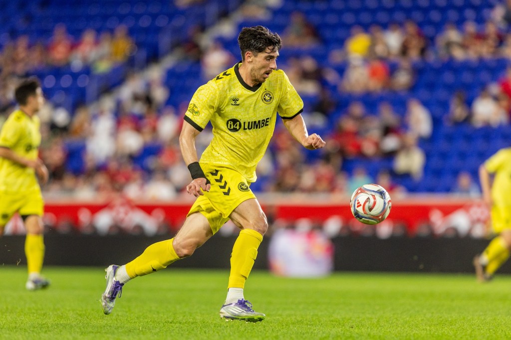 Trevor Amann moves upfield with the ball in the Pittsburgh Riverhounds' U.S. Open Cup match against Red Bull New York on April 15, 2026 at Sports Illustrated Stadium in Harrison, N.J. (Photo: Mallory Neil/Riverhounds SC)