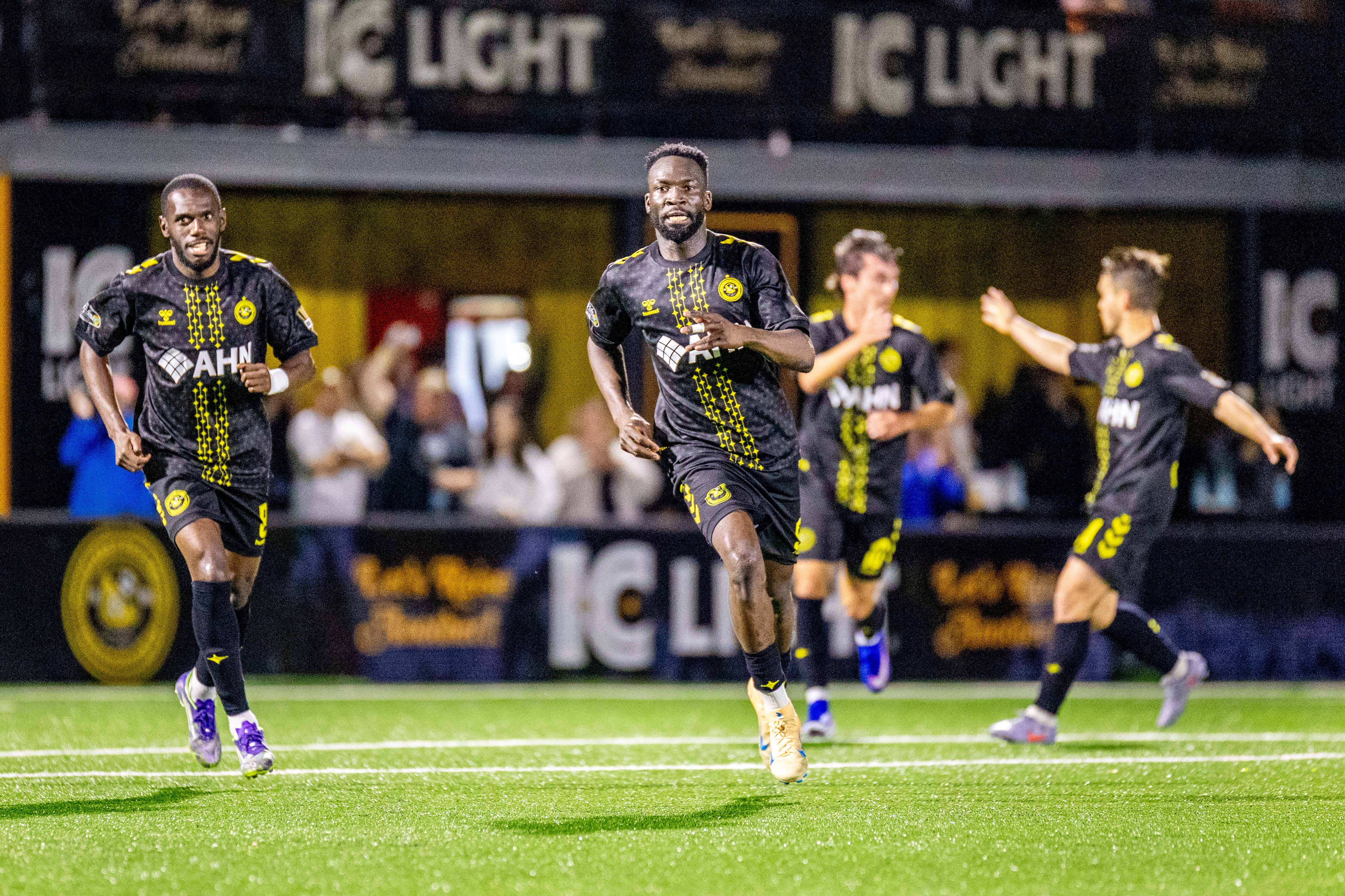 Albert Dikwa leads teammates in celebration after his second goal in a 2-0 win over Detroit City FC on April 18, 2026 at Highmark Stadium in Pittsburgh. (Photo: Chris Cowger/Riverhounds SC)