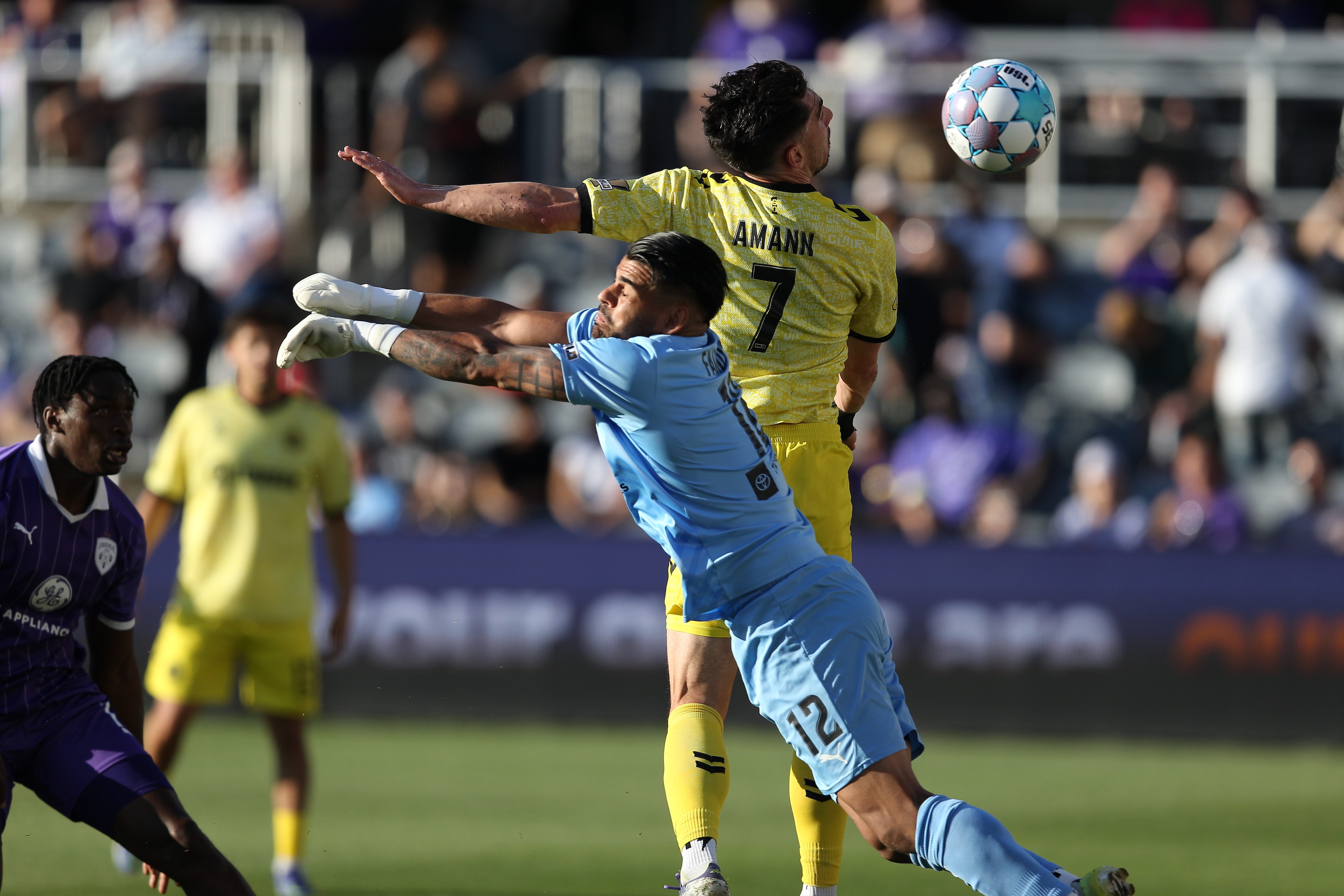 Trevor Amann scores with a header in front of Louisville City FC goalkeeper Danny Faundez in the Pittsburgh Riverhounds' 2-0 win on May 9, 2026 at Lynn Family Stadium in Louisville, Ky. (Photo: EM Dash Photography/Louisville City FC)