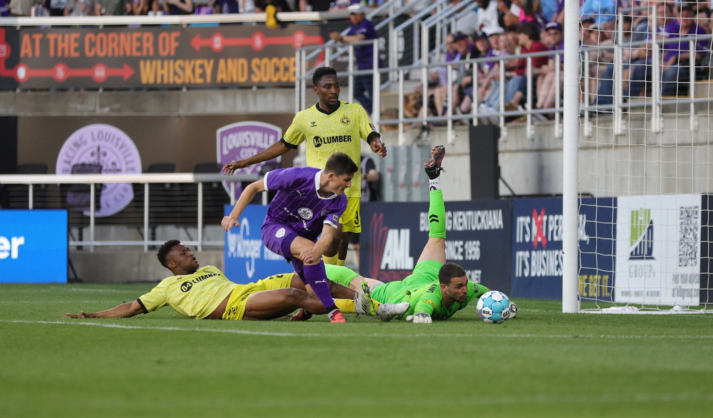 Nico Campuzano makes a close-range save of a shot by Louisville City FC's Chris Donovan in the Pittsburgh Riverhounds' 2-0 win May 9, 2026 at Lynn Family Stadium in Louisville, Ky. (Photo: EM Dash Photography/Louisville City FC)