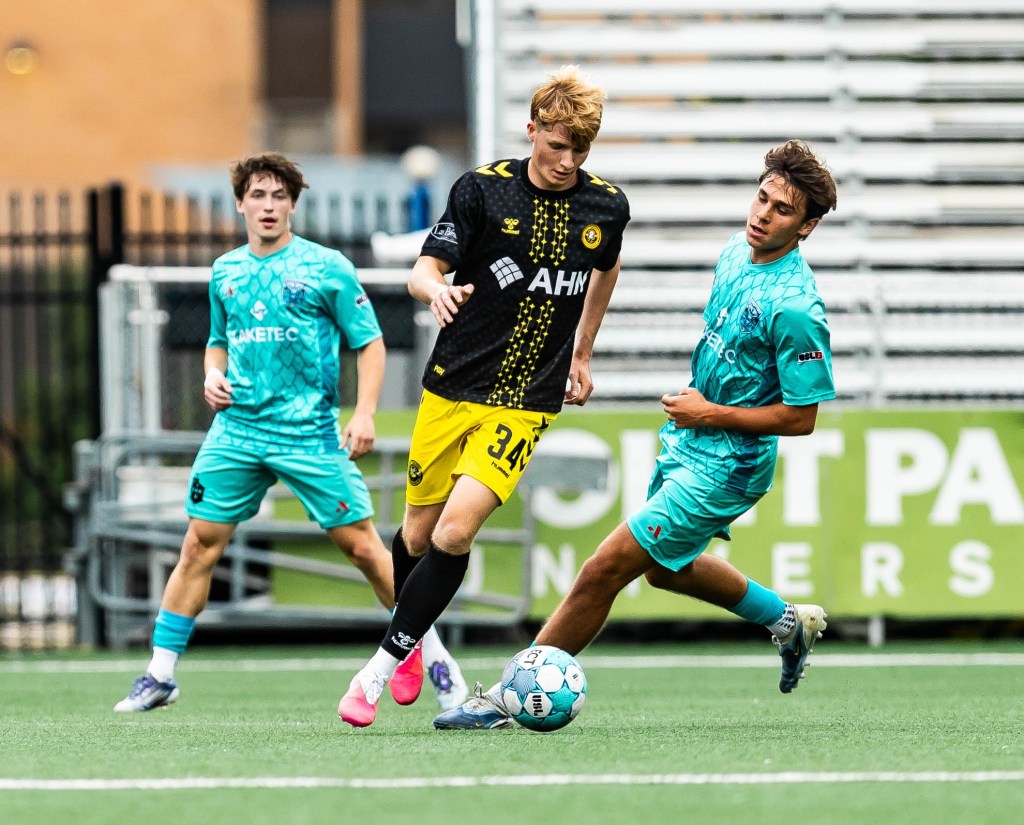 Daniel Firek turns away from a pair of Lorain County Leviathan defenders in Pittsburgh Riverhounds 2's victory June 17, 2026 at F.N.B. Stadium. (Photo: Mallory Neil/Riverhounds SC)