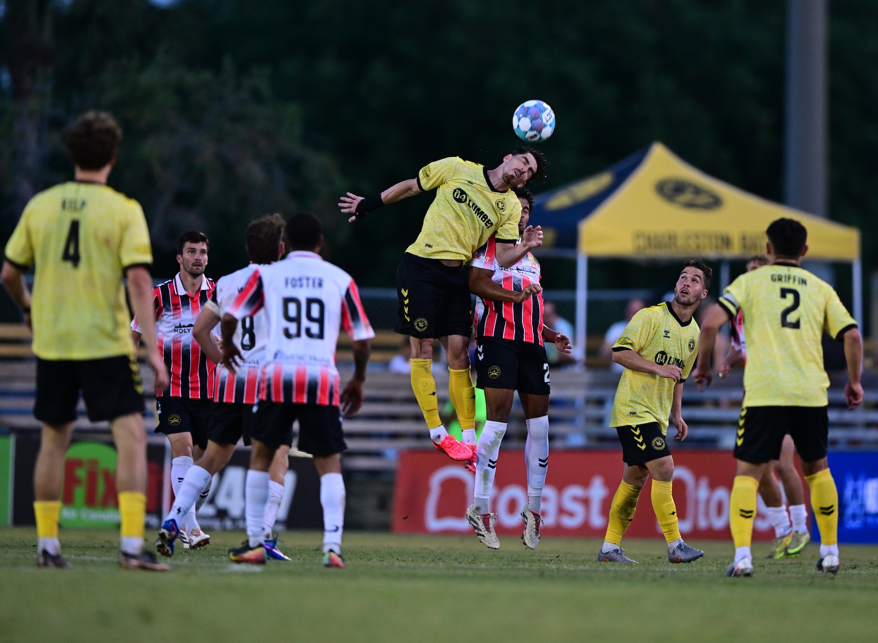 Trevor Amann wins a header amongst traffic in the Pittsburgh Riverhounds' match against the Charleston Battery on June 6, 2026 at Patriots Point in Mount Pleasant, S.C. (Photo: Charleston Battery)