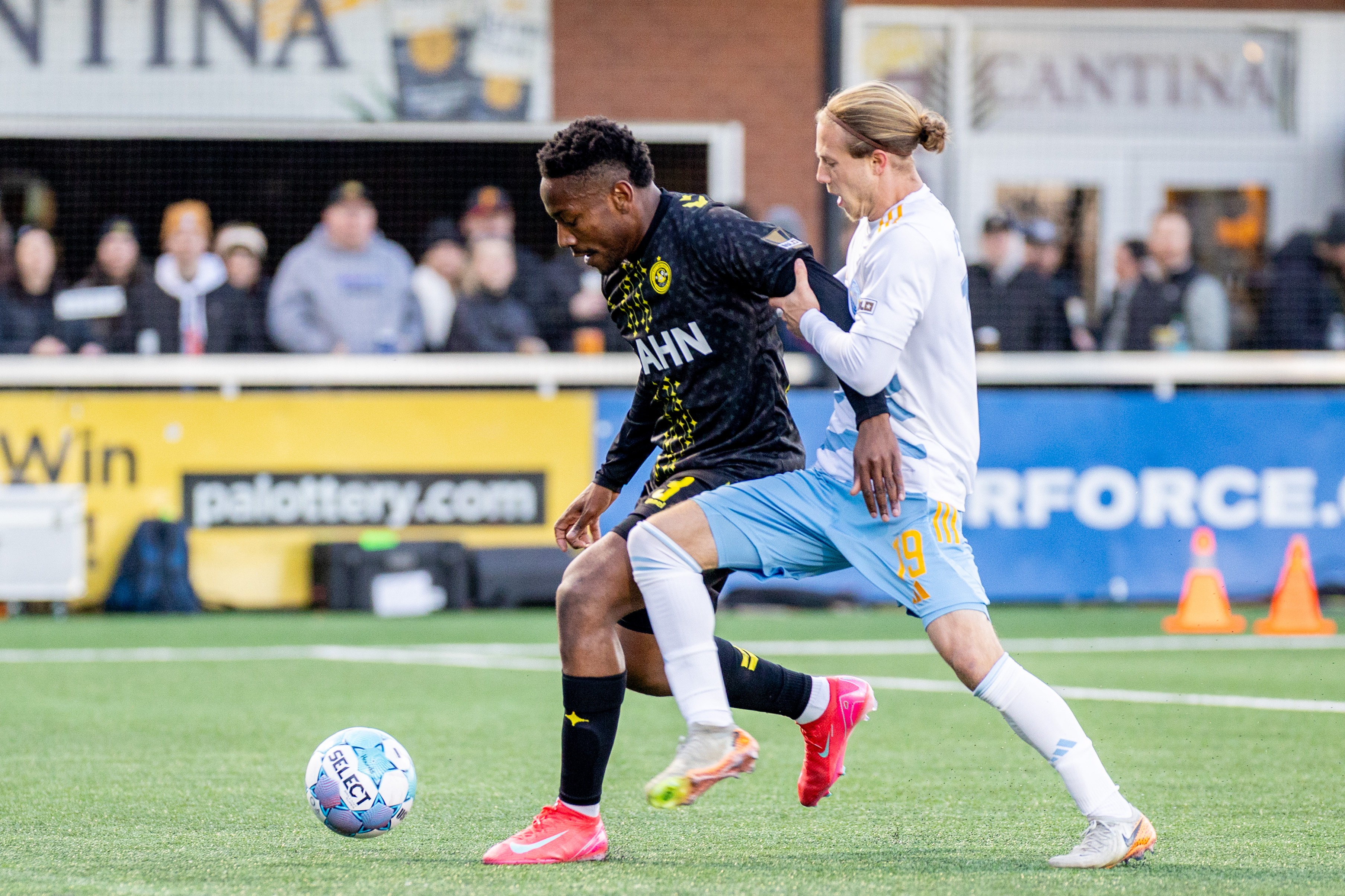 Perrin Barnes holds off Sporting Jacksonville's Rafferty Pedder in the Pittsburgh Riverhounds' 3-2 win on March 28, 2026 at Highmark Stadium in Pittsburgh. (Photo: Chris Cowger/Riverhounds SC)
