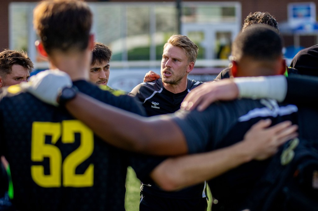 Riverhounds 2 head coach Josh Kremers speaks to his players on the field at F.N.B. Stadium. (Photo: Chris Cowger/Riverhounds SC)