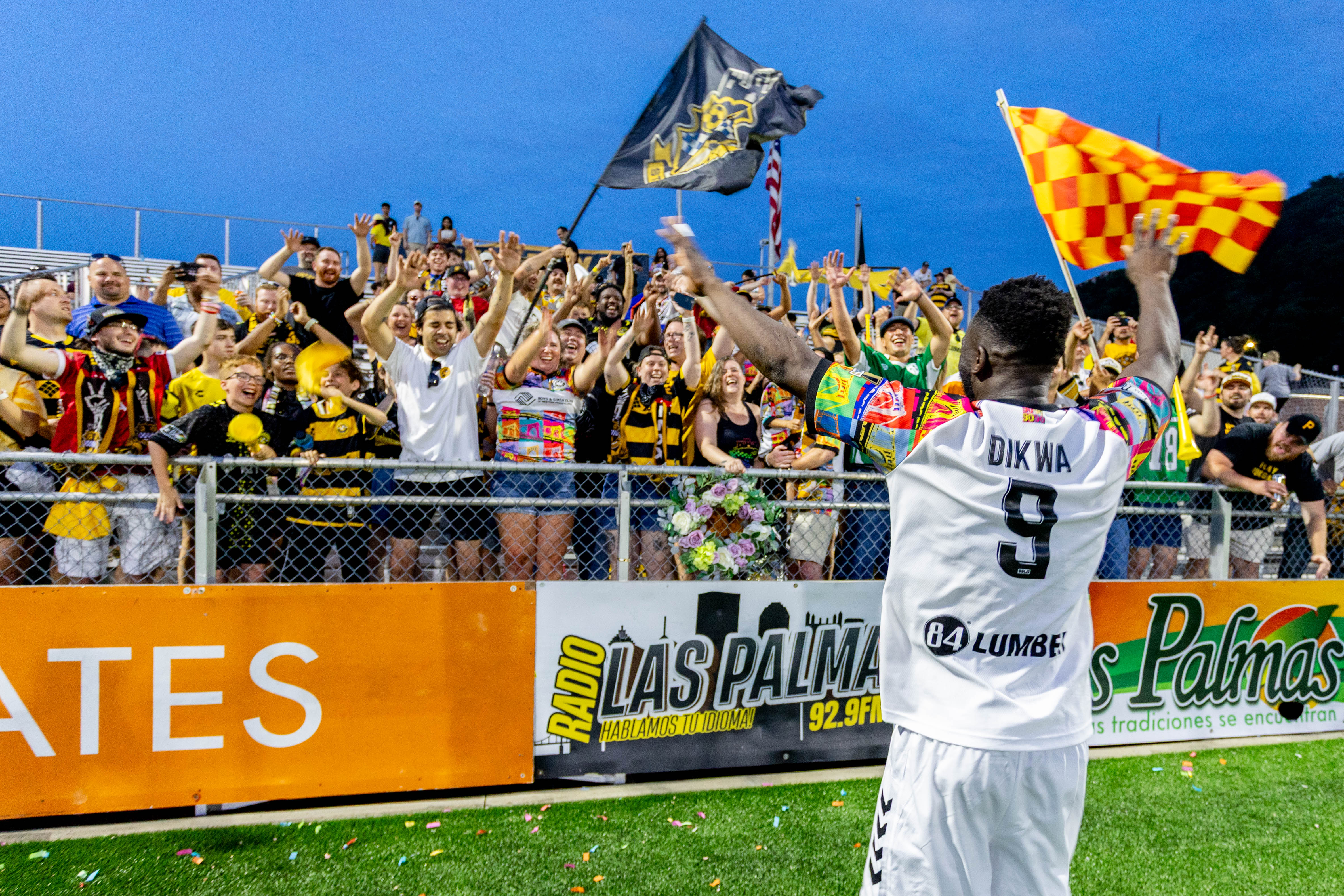 Albert Dikwa celebrates with fans in the Supporters' Section after the Pittsburgh Riverhounds' 1-0 win over Indy Eleven on June 13, 2026 at F.N.B. Stadium in Pittsburgh. (Photo: Chris Cowger/Riverhounds SC)