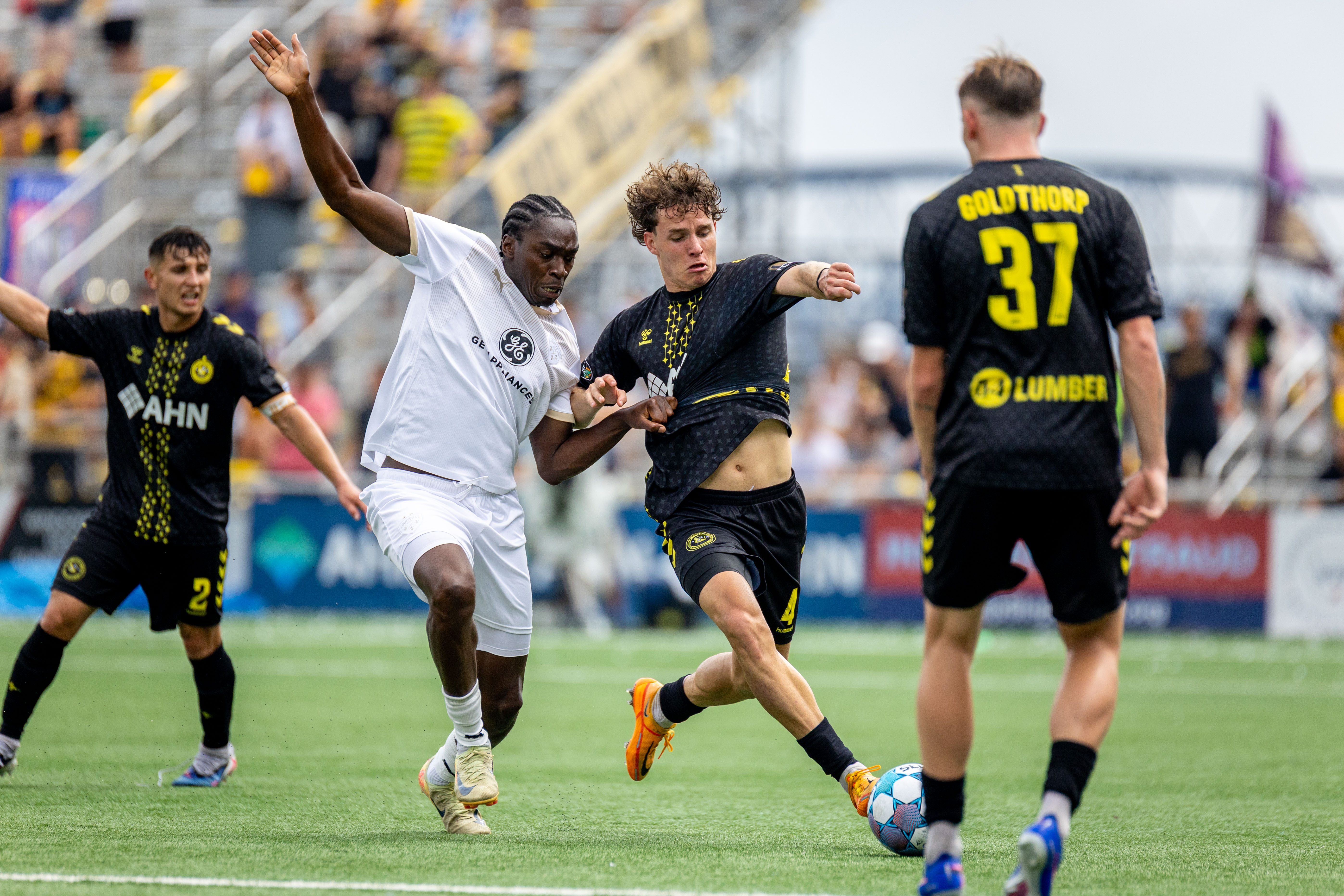 Pittsburgh Riverhounds defender Lasse Kelp holds off Louisville City FC's Tola Showunmi in the Hounds' 3-1 win on July 18, 2026 at F.N.B. Stadium in Pittsburgh. (Photo: Chris Cowger/Riverhounds SC)