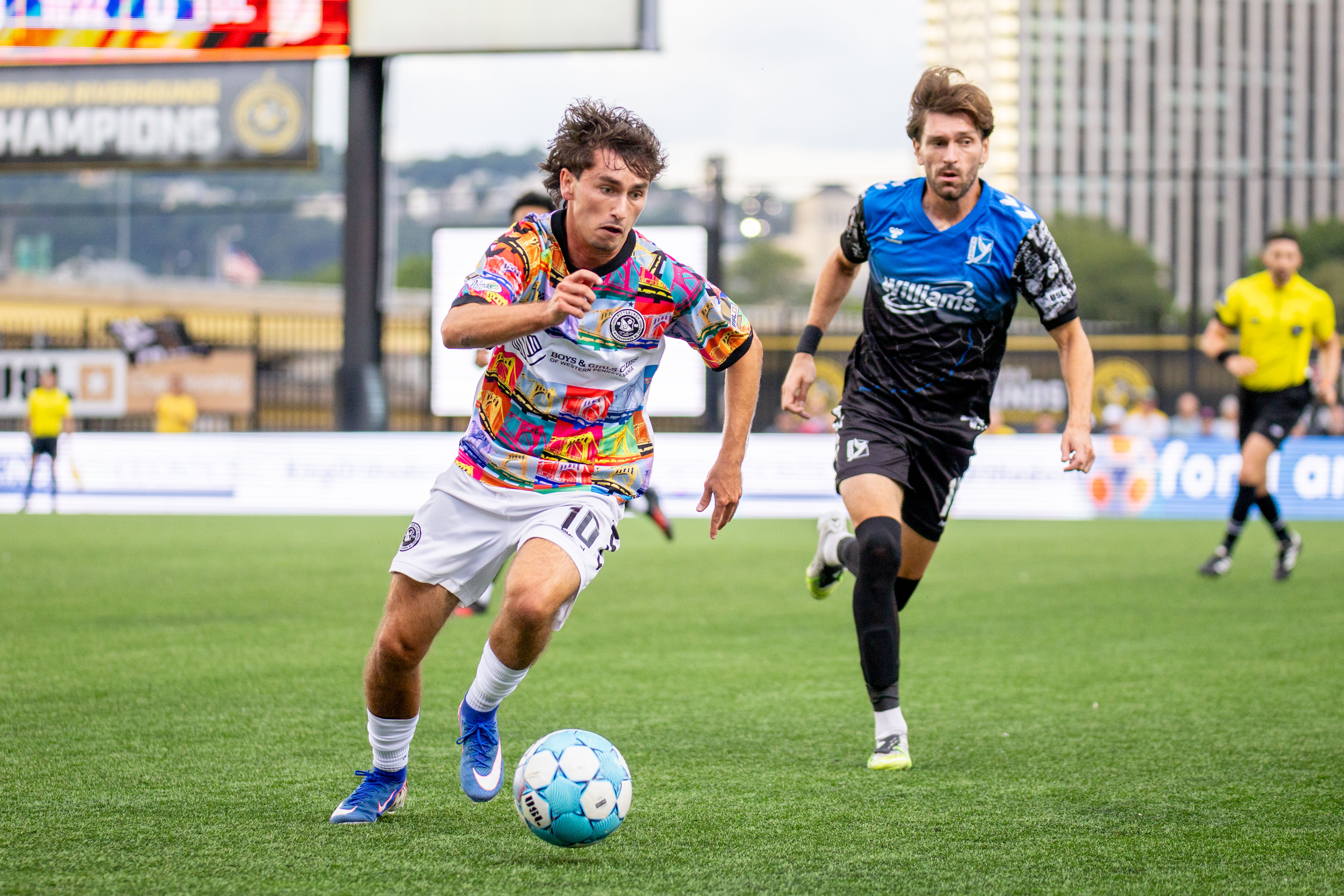 Charles Ahl dribbles away from pressure in the Pittsburgh Riverhounds' match against FC Tulsa on July 29, 2026 at F.N.B. Stadium in Pittsburgh. (Photo: Chris Cowger/Riverhounds SC)