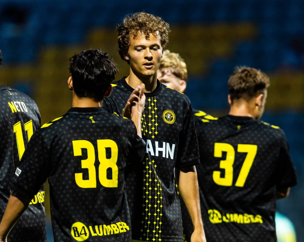 Niklas Sørensen celebrates with teammate Caleb Borneo (38) after Pittsburgh Riverhounds 2's 3-2 win over the Lorain County Leviathan in USL League Two play on June 17, 2026 at F.N.B. Stadium in Pittsburgh. (Photo: Mallory Neil/Riverhounds SC)