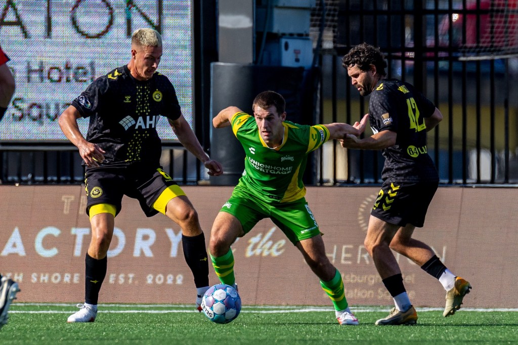 Owen Mikoy (left) and Jackson Walti close down the Tampa Bay Rowdies' MD Myers in the Pittsburgh Riverhounds match Aug. 29, 2026 at F.N.B. Stadium in Pittsburgh. (Photo: Chris Cowger/Riverhounds SC)