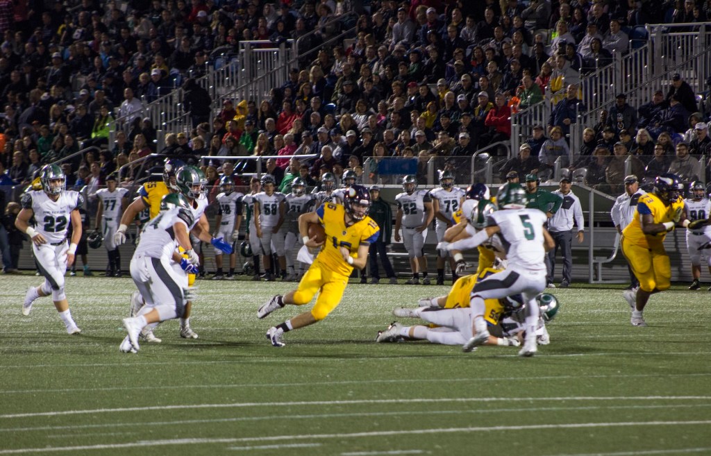 Central Catholic quarterback Troy Fisher carries the ball in a high school football game against Pine-Richland on Sept. 30, 2016 at Highmark Stadium in Pittsburgh. (Riverhounds SC file photo)