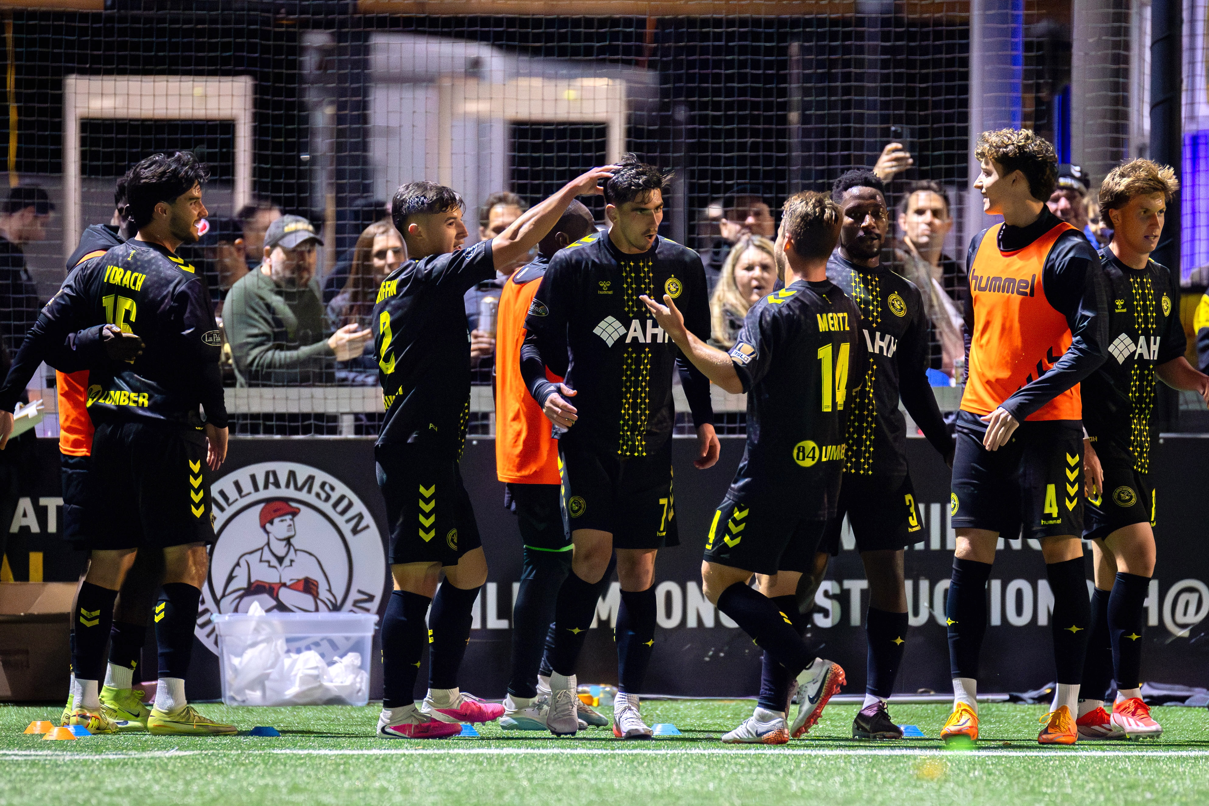 Trevor Amann (7, center) is congratulated by his teammates after scoring the opening goal in the Pittsburgh Riverhounds' 2-1 win over Birmingham Legion FC on Oct. 24, 2026 at F.N.B. Stadium in Pittsburgh. (Photo: Chris Cowger/Riverhounds SC)