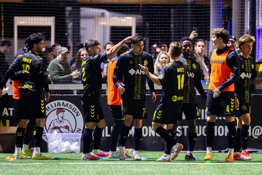 Trevor Amann (7, center) is congratulated by his teammates after scoring the opening goal in the Pittsburgh Riverhounds' 2-1 win over Birmingham Legion FC on Oct. 24, 2026 at F.N.B. Stadium in Pittsburgh. (Photo: Chris Cowger/Riverhounds SC)