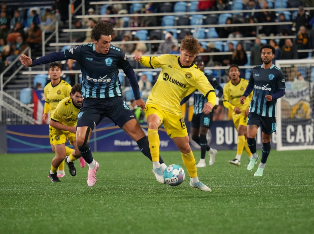 Sam Bassett battles Rhode Island FC's Hugo Bacharach in the Pittsburgh Riverhounds' 1-1 draw on Oct. 17, 2026 at Centreville Bank Stadium in Pawtucket, R.I. (Photo: Rhode Island FC)